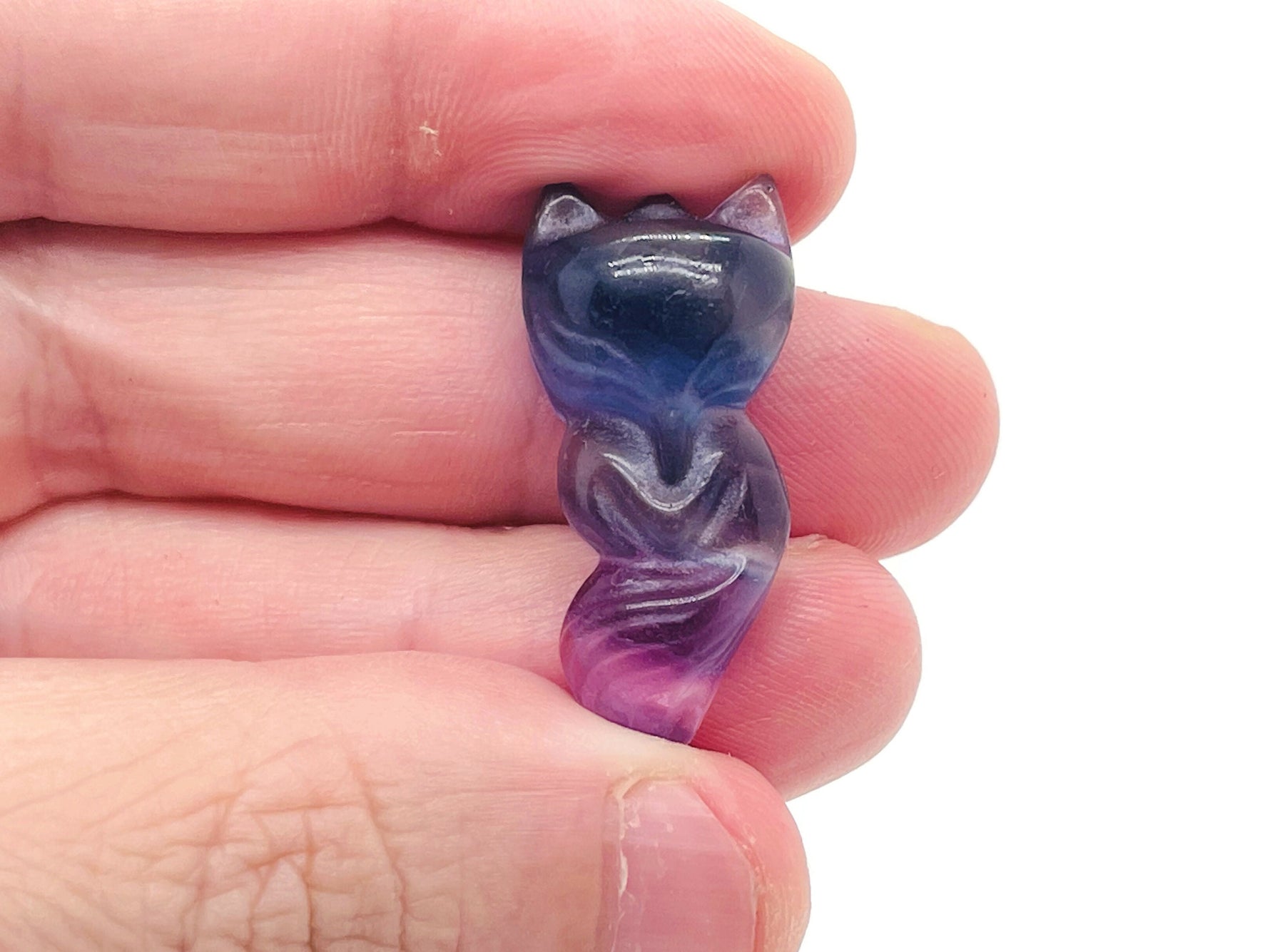 Fluorite gemstone carving of a nine-tailed fox, detailed and colorful, crafted by GemstoneGO.