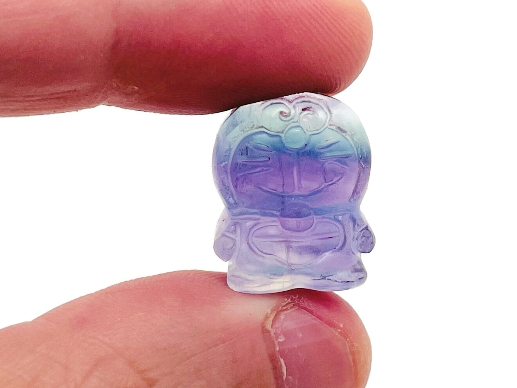 Fluorite cat carving gemstone by GemstoneGO, featuring vibrant green and purple hues and detailed feline craftsmanship.