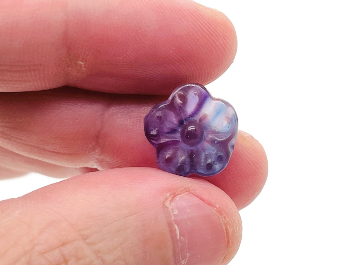 Mini fluorite flower gemstone carving by GemstoneGO, detailed multicolored fluorite flower sculpture on a clear background