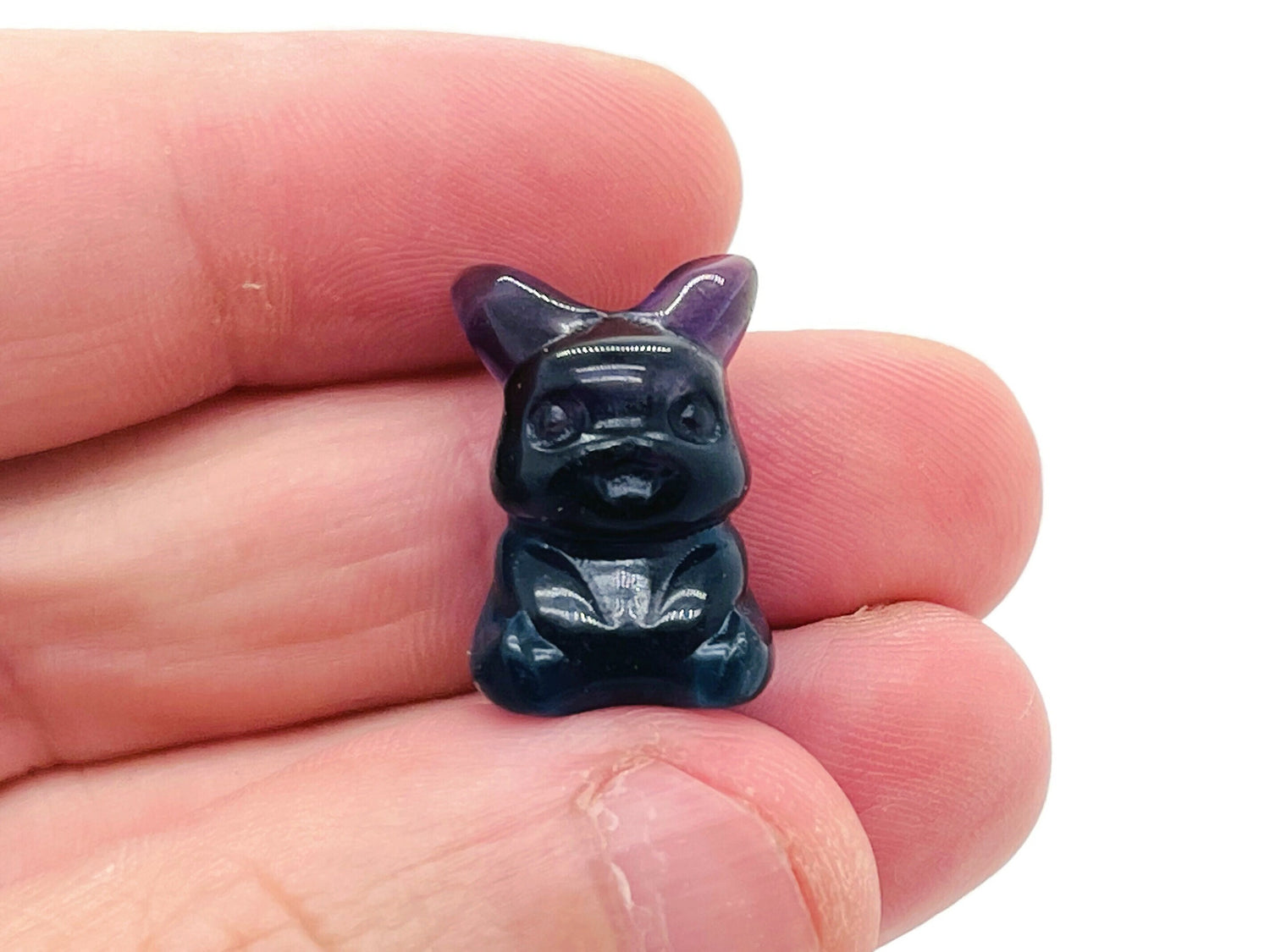Cute fluorite gemstone carving of an animal, showcasing vibrant colors and detailed craftsmanship from GemstoneGO.