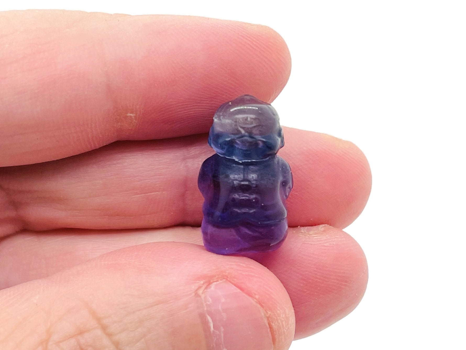Small fluorite mini crystal carving gemstone by GemstoneGO, showcasing vibrant purple and green mineral details.
