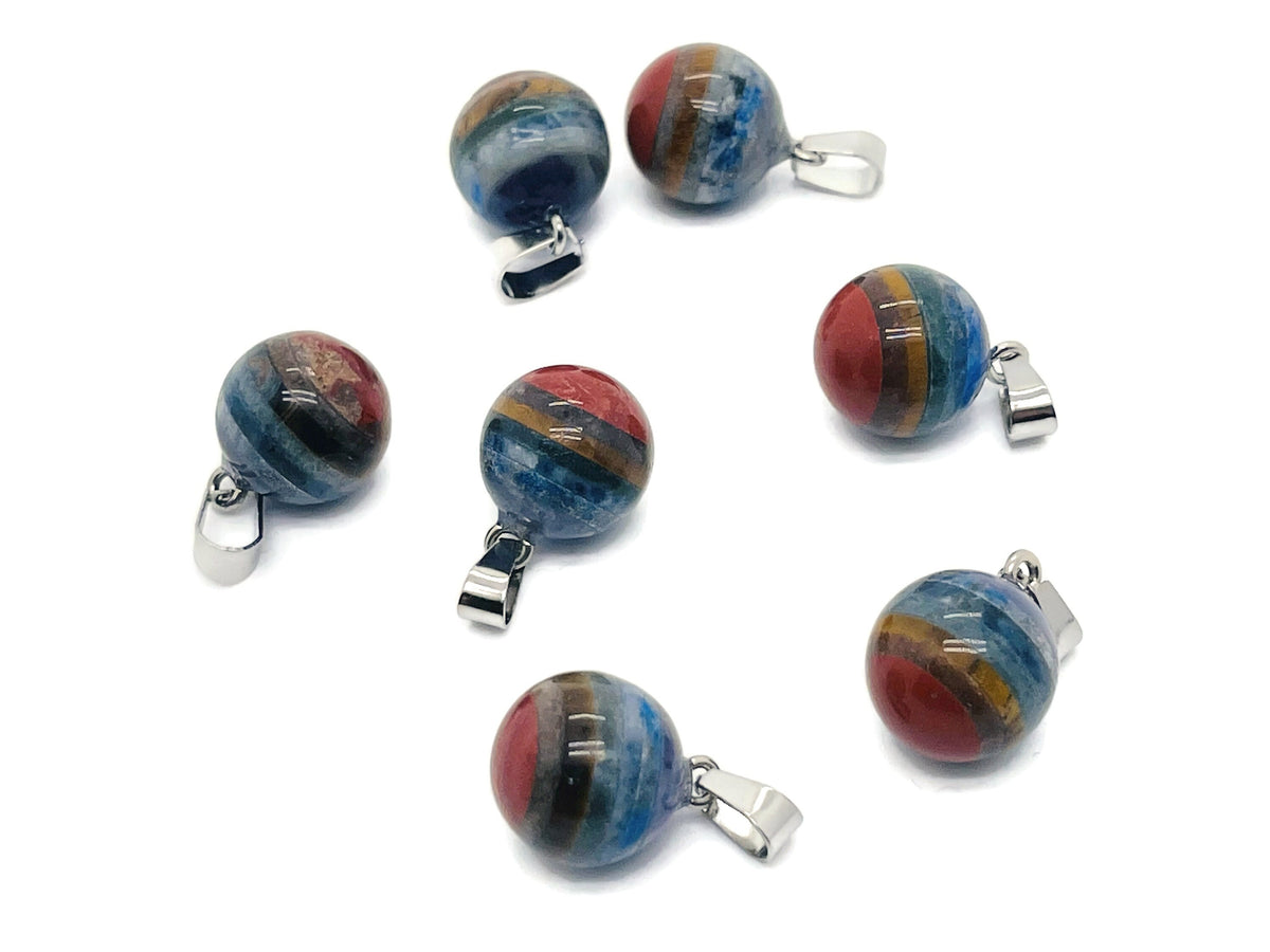 Chakra crystal pendant with seven stones from GemstoneGO, featuring a silver chain and vibrant multicolored chakra stones.