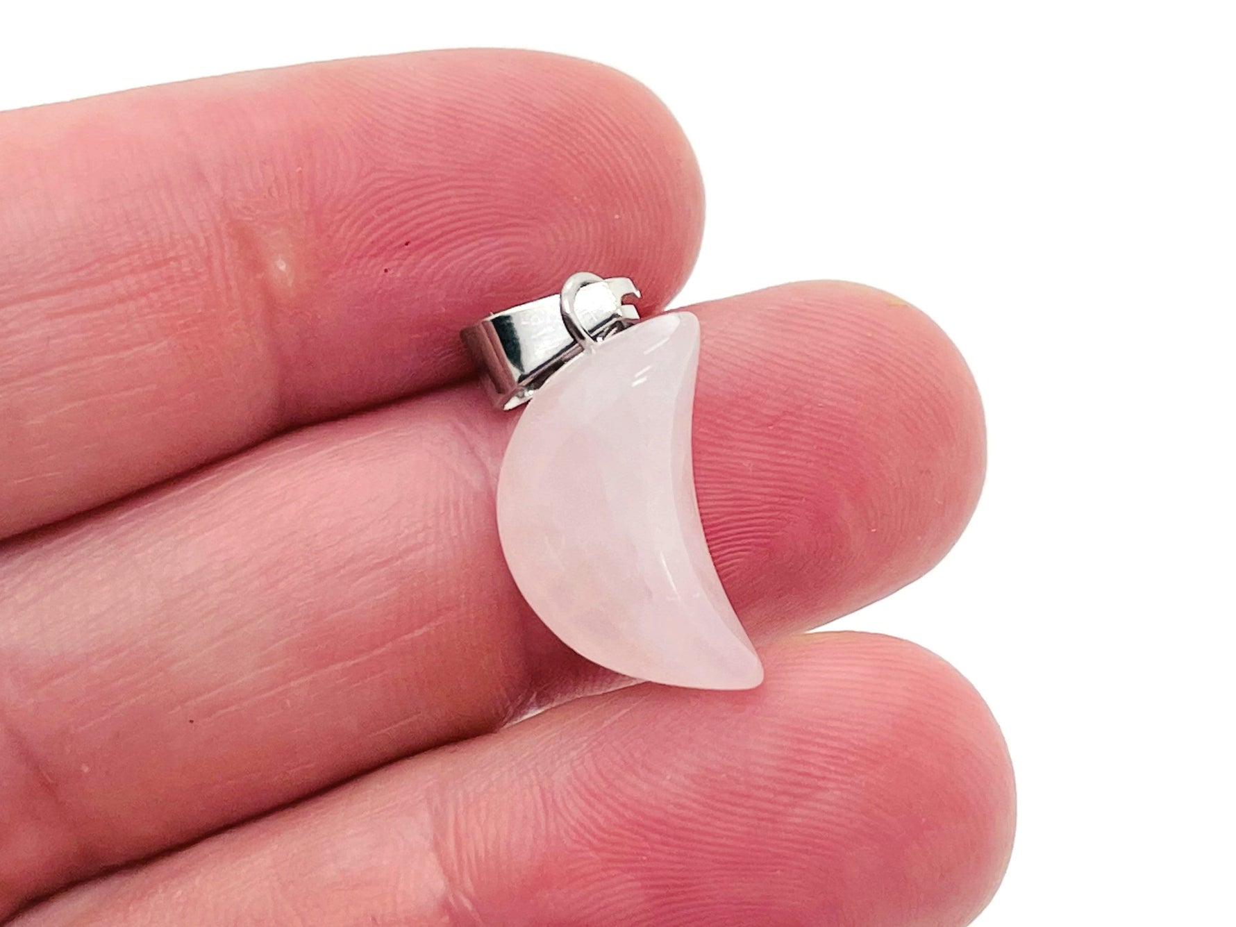 Rose Quartz moon crystal pendant from GemstoneGO, featuring a polished pink gemstone shaped like a moon for jewelry making.
