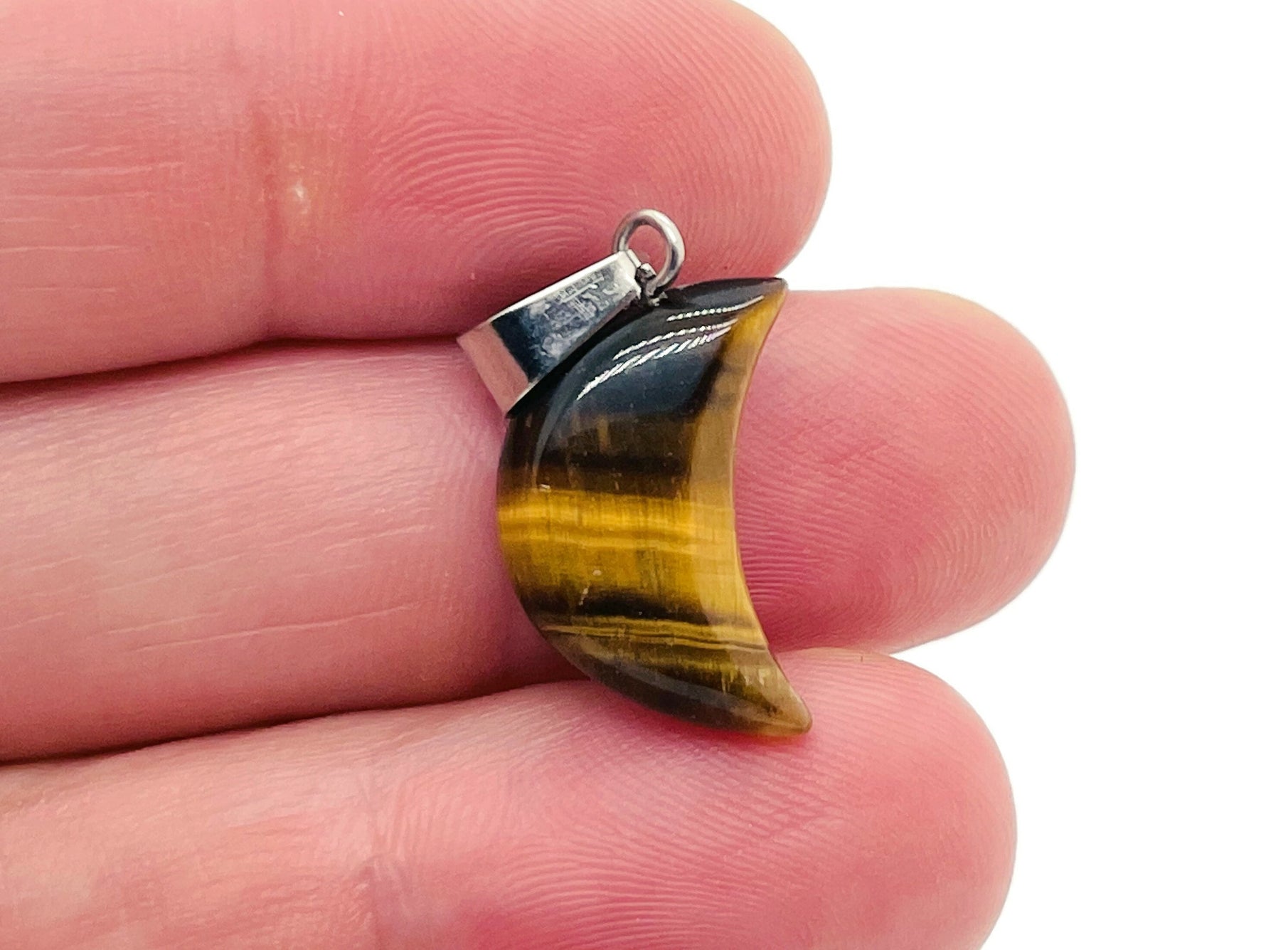 Tiger Eye moon crystal pendant from GemstoneGO, showcasing a polished moon-shaped gemstone for jewelry making.