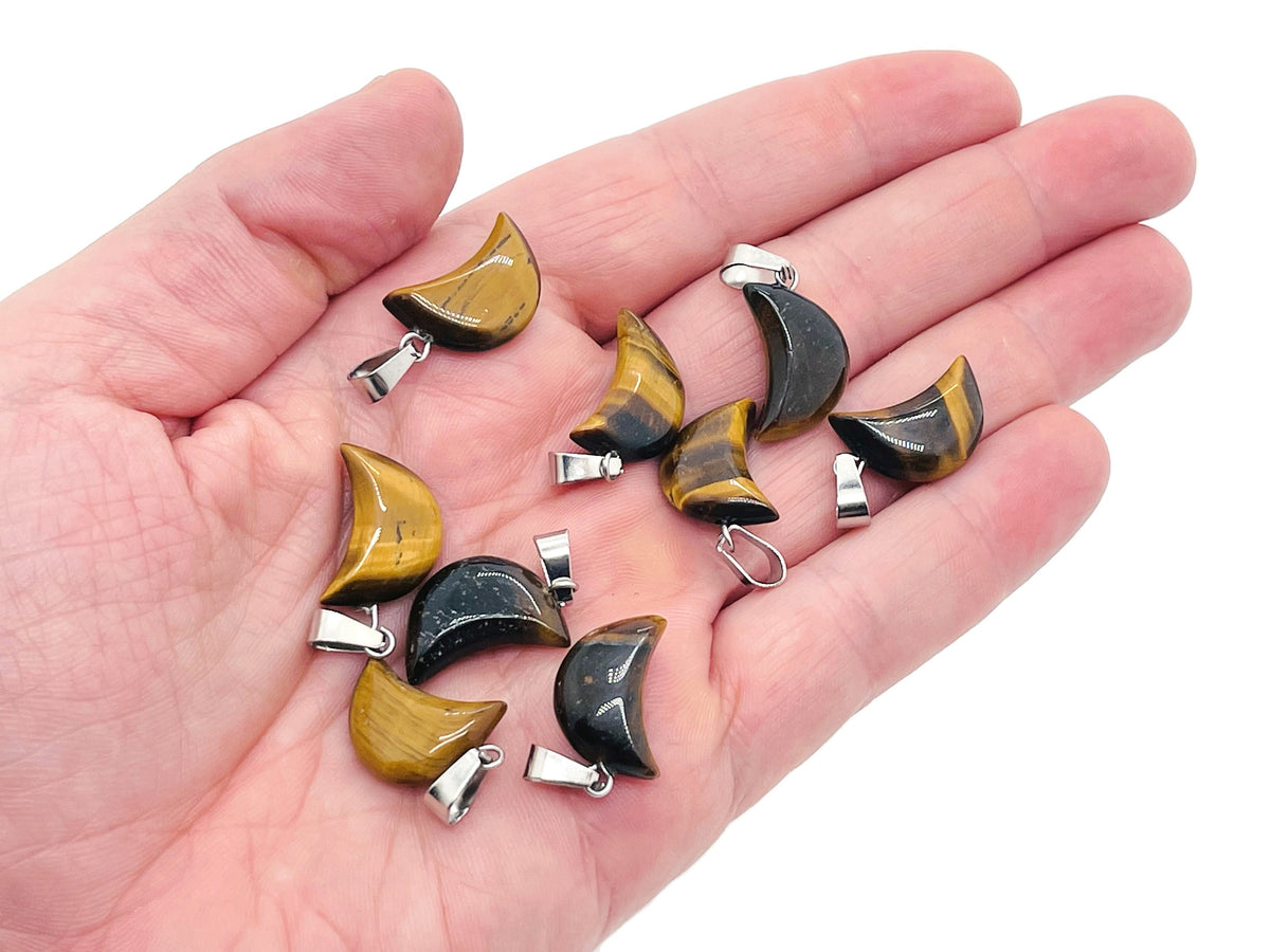 Tiger Eye moon crystal pendant from GemstoneGO, featuring a polished gemstone in a moon shape for jewelry making.