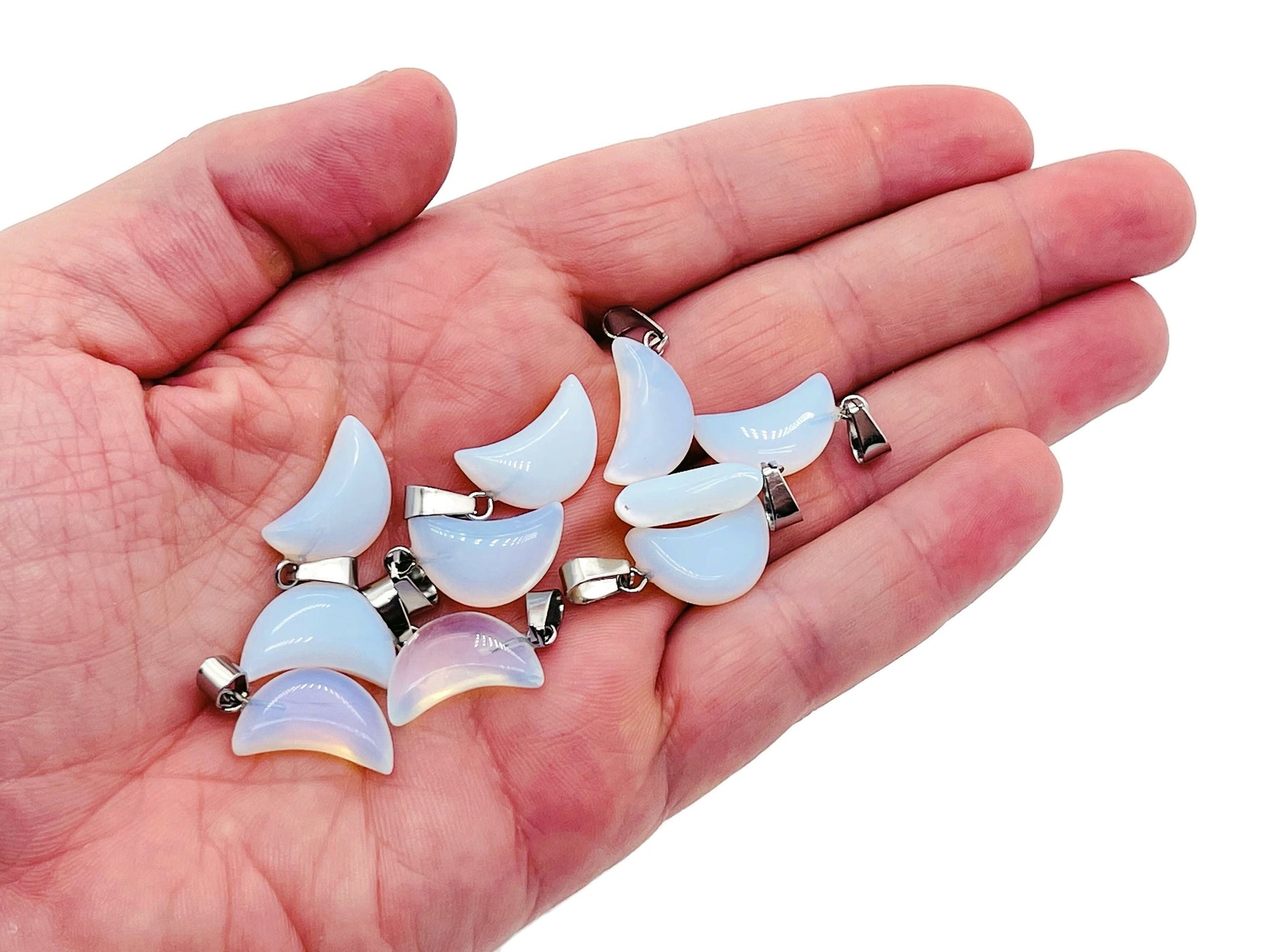 Opalite moon crystal pendant from GemstoneGO, showcasing a luminous, smooth moon-shaped gemstone for jewelry making.