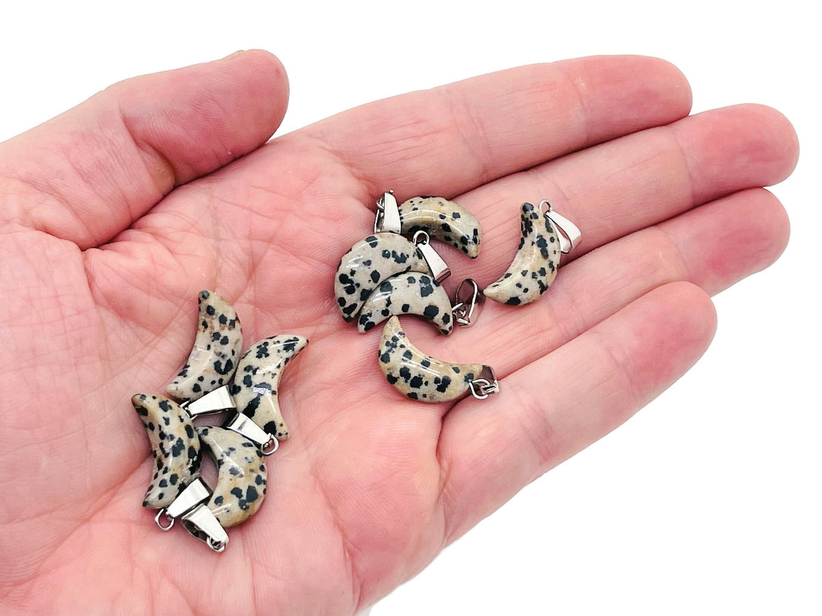 Dalmatian Jasper moon crystal pendant from GemstoneGO featuring black and cream spotted gemstone for jewelry making.