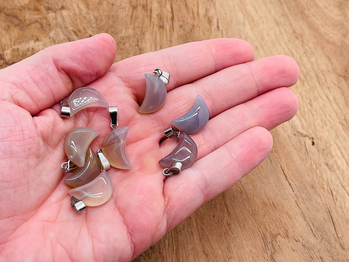 Grey agate moon crystal pendant from GemstoneGO, natural stone jewelry making supply with polished round shape and moon motif.