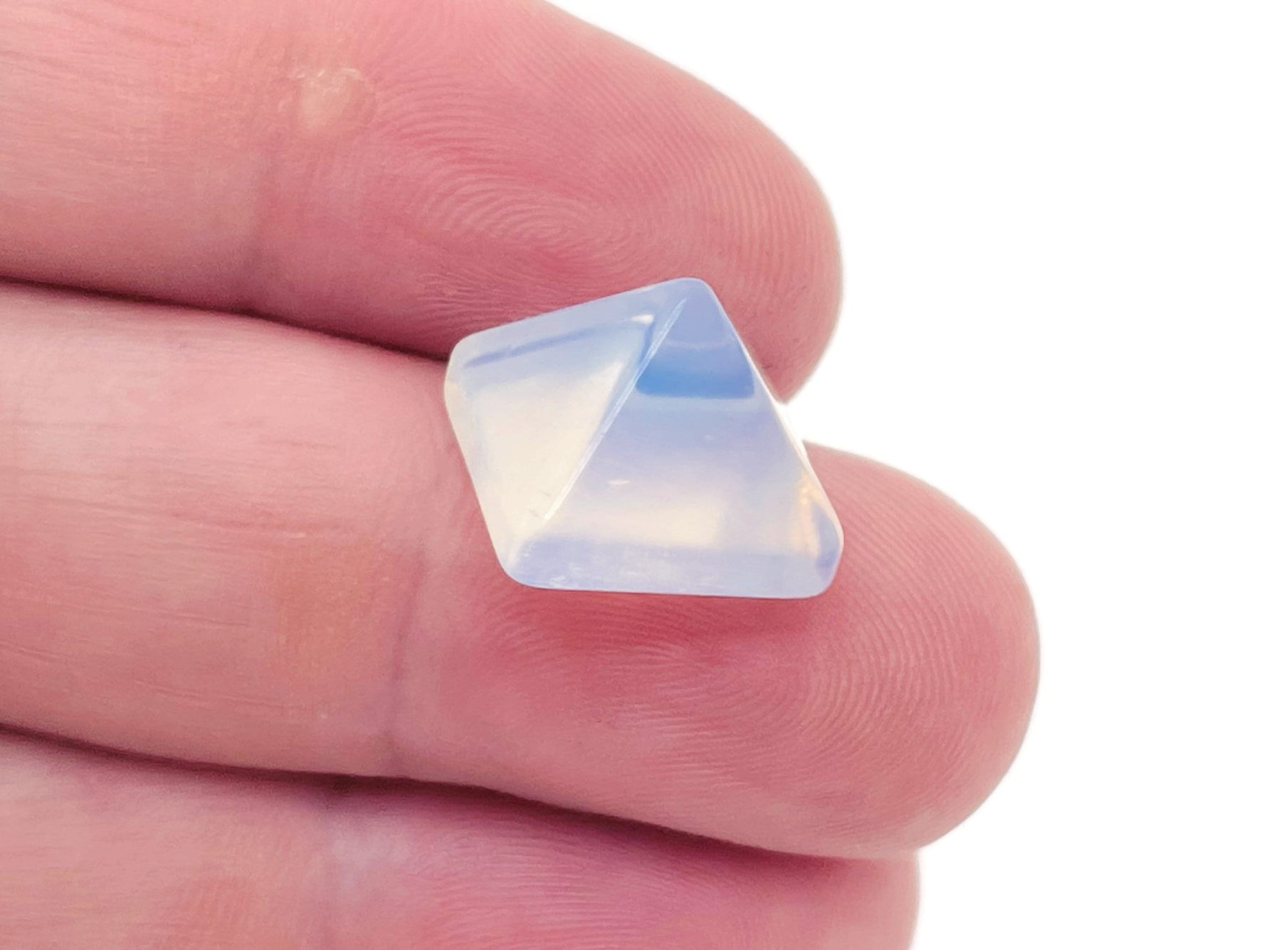 Opalite pyramid gemstone carving, 14mm, from GemstoneGO, featuring smooth, translucent white and blue hues in a carved pyramid shape.