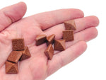 14mm Goldstone pyramid carving gemstone from GemstoneGO, showcasing a sparkling, polished goldstone pyramid with intricate details.