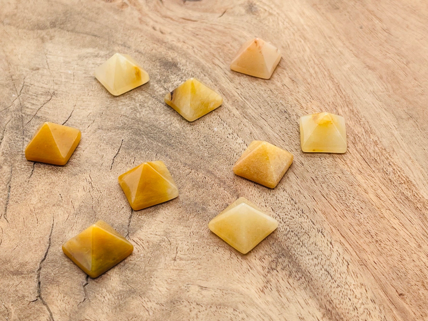 Yellow jade pyramid gemstone carving, 14mm, from GemstoneGO, showing detailed yellow jade pyramid with smooth polished surface.