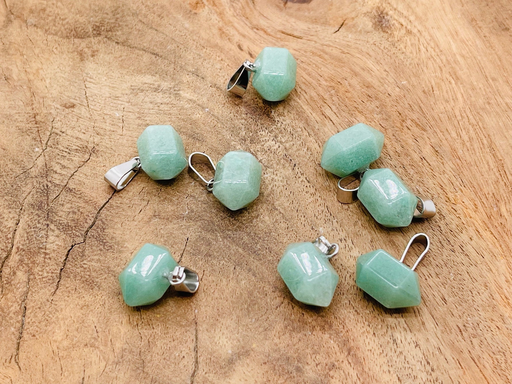 Aventurine point crystal pendant from GemstoneGO, featuring a polished green gemstone with natural inclusions, perfect for jewelry making.