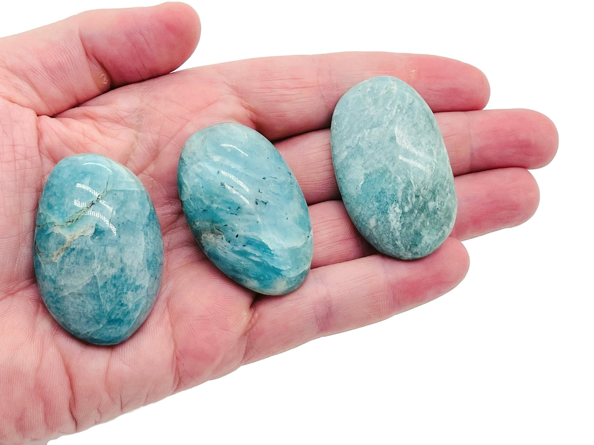 Amazonite palm gemstone spa stone from GemstoneGO, smooth blue-green gemstone for relaxation and massage therapy.
