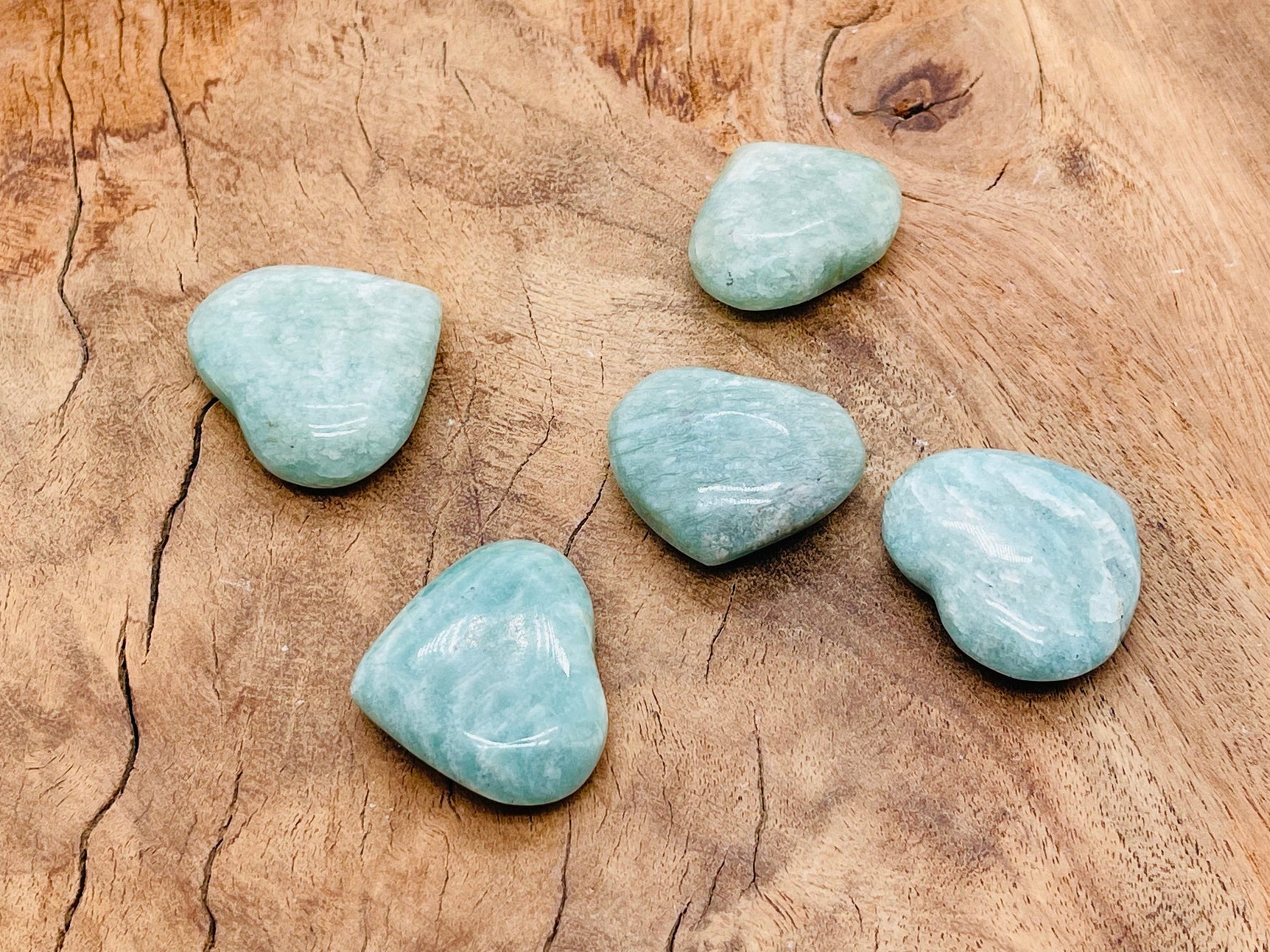 Polished Amazonite heart-shaped gemstone from GemstoneGO, showcasing vibrant blue-green color and smooth, rounded surface.