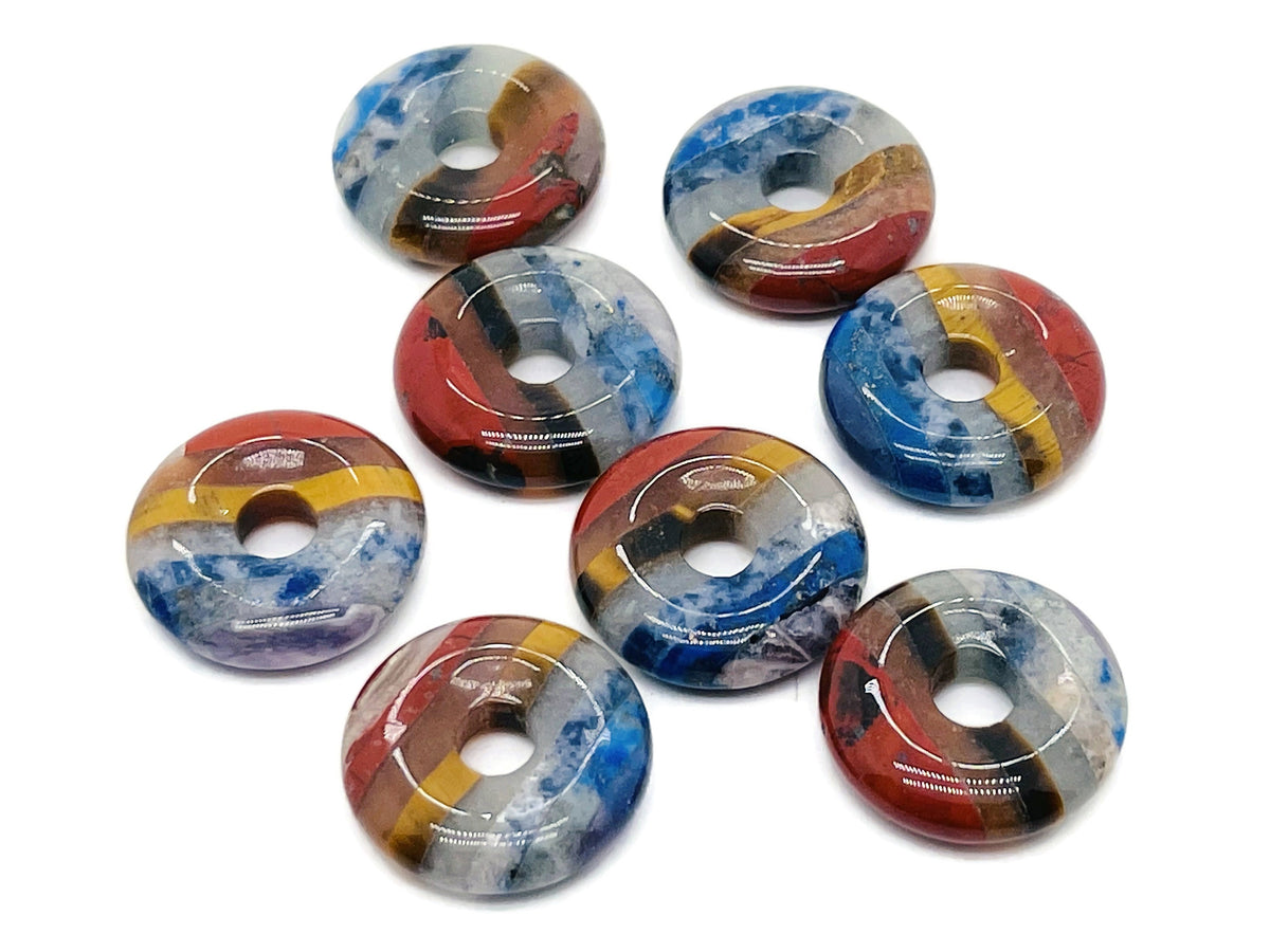 7 Chakra Crystal Donut Pi Stone 20mm from GemstoneGO, featuring vibrant chakra colors and polished gemstone details.