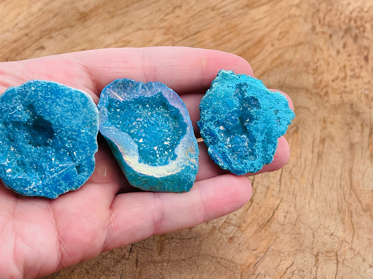 Blue Aura Oco Agate geode raw crystal from GemstoneGO, showing a vibrant blue and natural textured agate crystal formation.