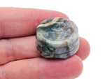 Moss agate crystal sphere on carved gemstone stand, decorative home decor piece showing green and brown mineral patterns.