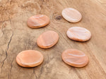 Orange aventurine worry stone from GemstoneGO, 4.5x3.5cm soothing crystal for stress relief and meditation.