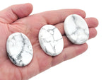 Smooth Howlite worry stone from GemstoneGO, 4.5x3.5cm soothing crystal for stress relief and meditation.