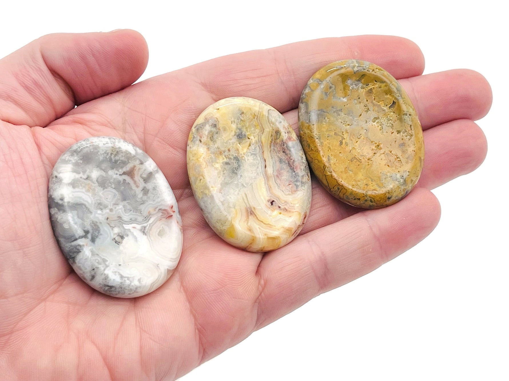 Crazy Lace Agate worry stone from GemstoneGO, soothing crystal with colorful banded patterns, measuring 4.5x3.5cm.