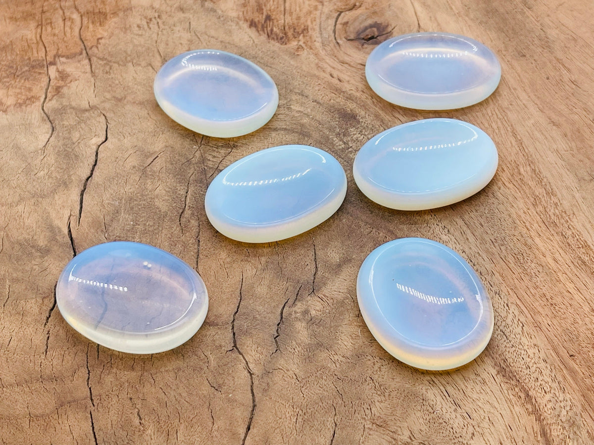 Opalite worry stone with smooth polished surface, small thumb-sized gemstone for meditation and stress relief, 4.5x3.5cm.
