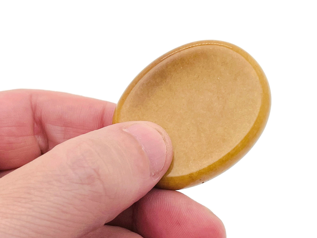Yellow jade worry stone from GemstoneGO, smooth 4.5x3.5cm crystal for soothing stress relief and calming energy.