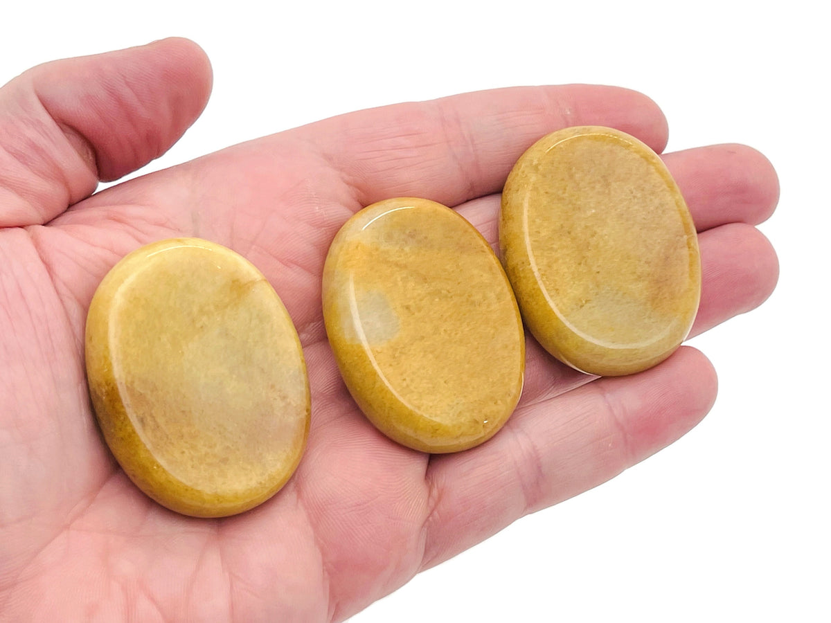 Yellow jade worry stone from GemstoneGO, 4.5x3.5cm soothing crystal for stress relief and calming gestures.