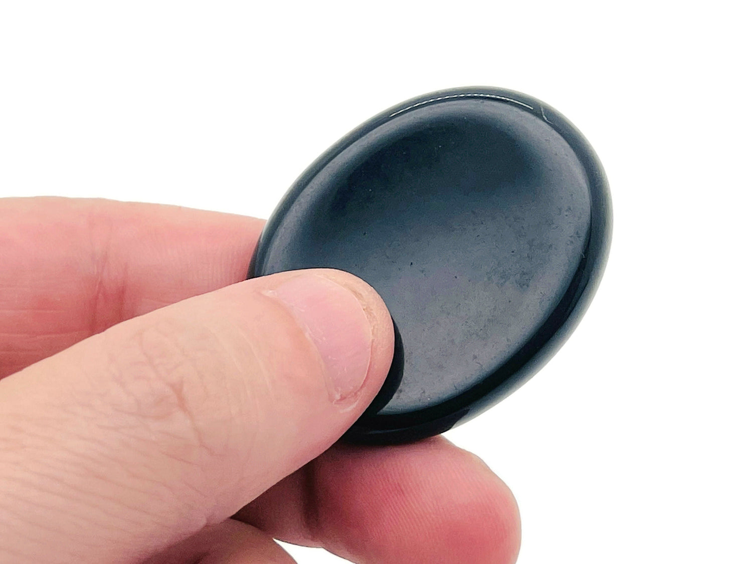 Smooth black obsidian worry stone from GemstoneGO, measuring 4.5x3.5cm, designed for soothing relief and calming energy.