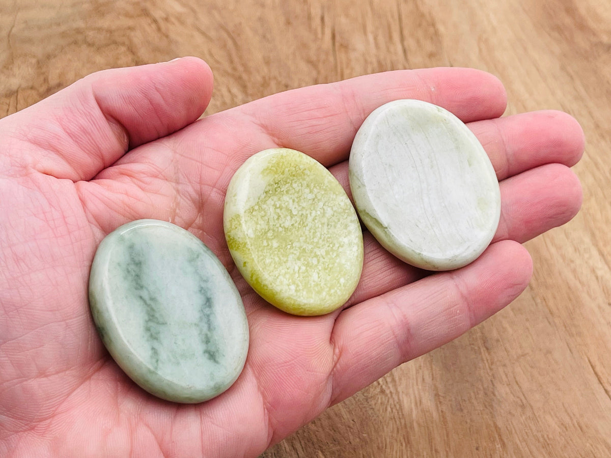 Smooth jade worry stone measuring 4.5x3.5cm from GemstoneGO, featuring a polished surface and soothing crystal appearance.
