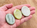 Smooth jade worry stone measuring 4.5x3.5cm from GemstoneGO, featuring a polished surface and soothing crystal appearance.