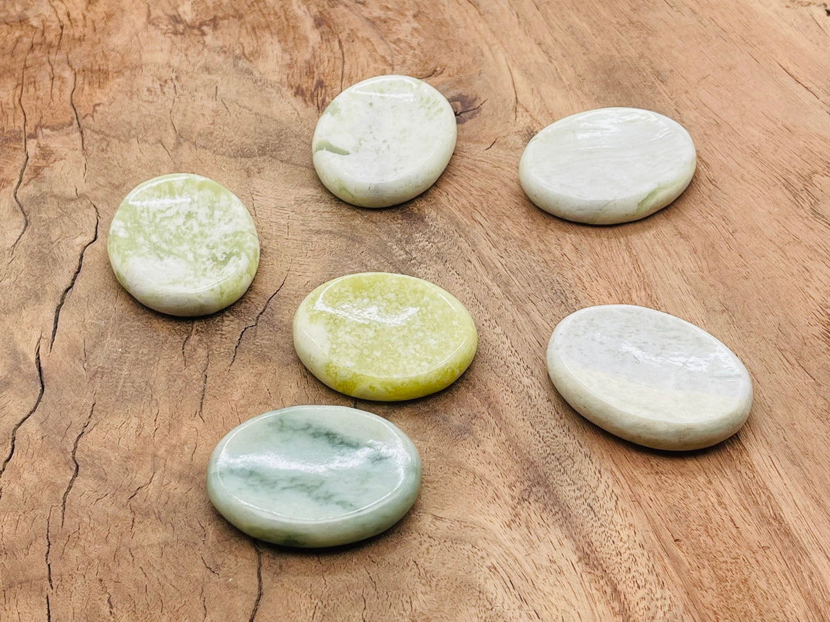 Smooth green jade worry stone from GemstoneGO, measures 4.5x3.5cm, features a polished, calming crystal surface.