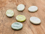 Smooth green jade worry stone from GemstoneGO, measures 4.5x3.5cm, features a polished, calming crystal surface.