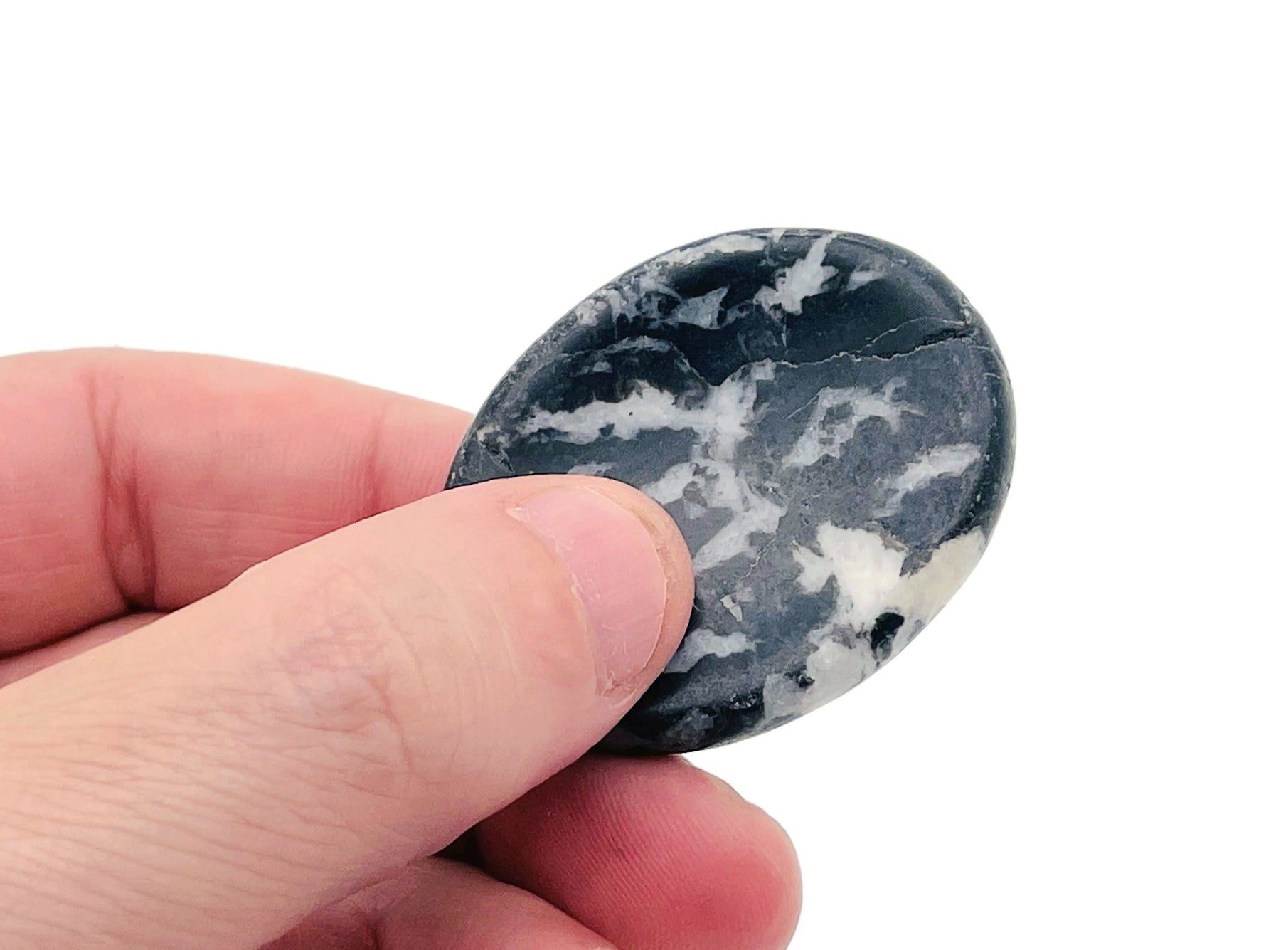 Zebra Calcite worry stone from GemstoneGO, 4.5x3.5cm, featuring black and white striped soothing crystal smooth palm stone.