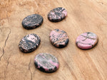 Rhodonite worry stone from GemstoneGO, soothing pink and black crystal, 4.5x3.5cm, smooth polished gemstone for stress relief