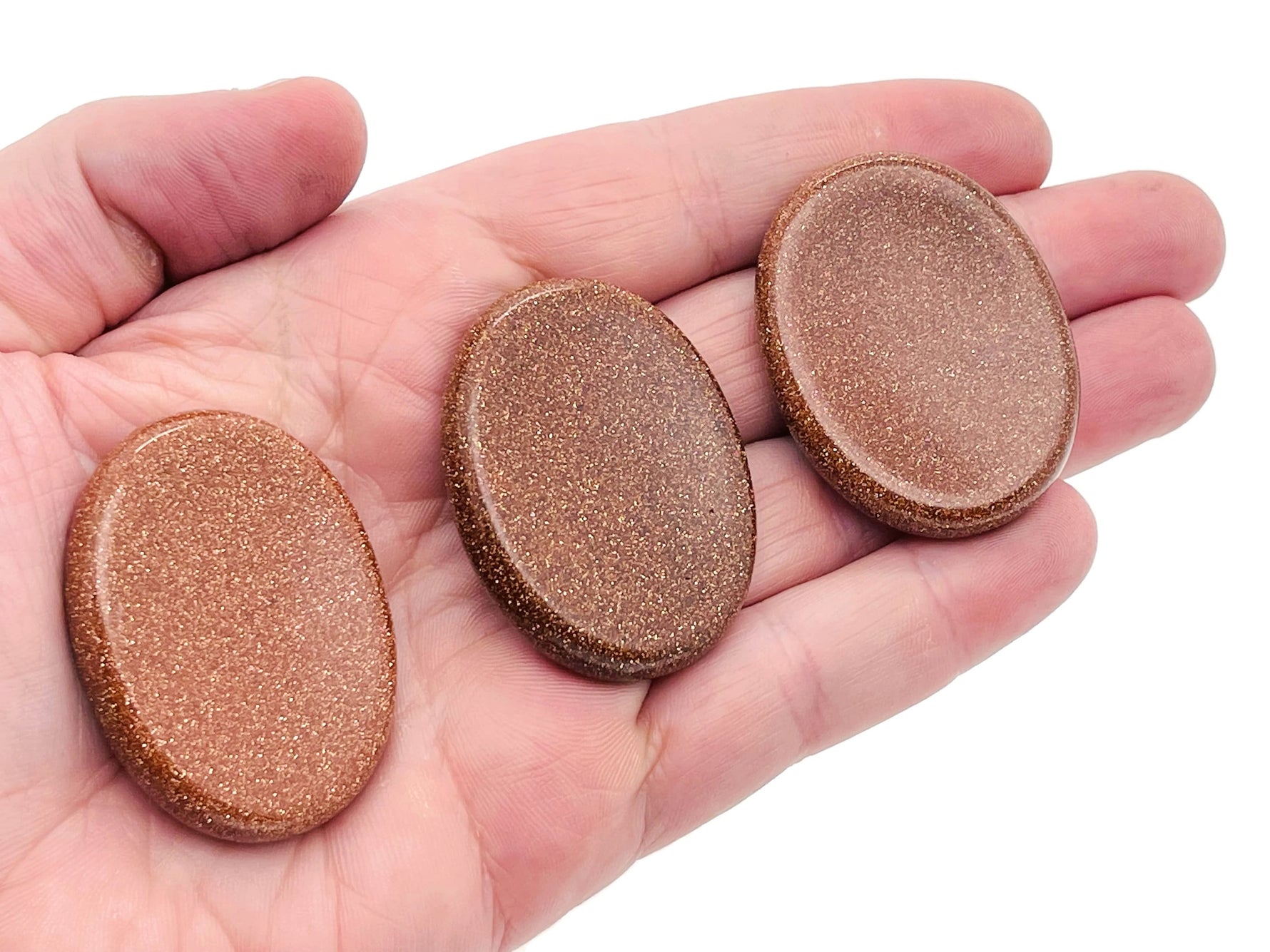 Goldstone worry stone from GemstoneGO, 4.5x3.5cm soothing crystal with smooth polished surface for stress relief.