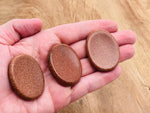 Goldstone worry stone from GemstoneGO, 4.5x3.5cm soothing crystal with a smooth polished surface for stress relief.