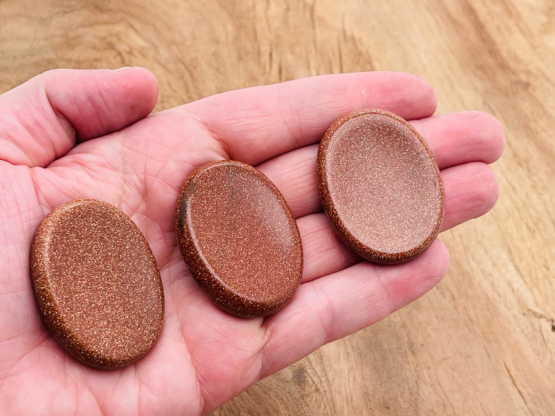 Goldstone worry stone from GemstoneGO, 4.5x3.5cm soothing crystal with a smooth polished surface for stress relief.