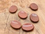 Goldstone worry stone from GemstoneGO, 4.5x3.5cm soothing crystal for stress relief and meditation.