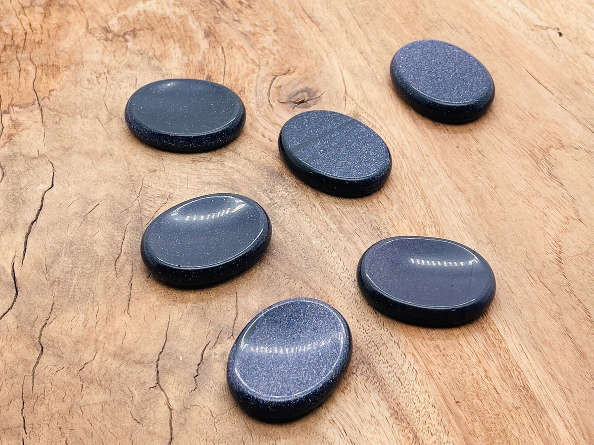 Blue Goldstone worry stone with soothing energy, measuring 4.5x3.5cm, crafted by GemstoneGO for calming and stress relief.
