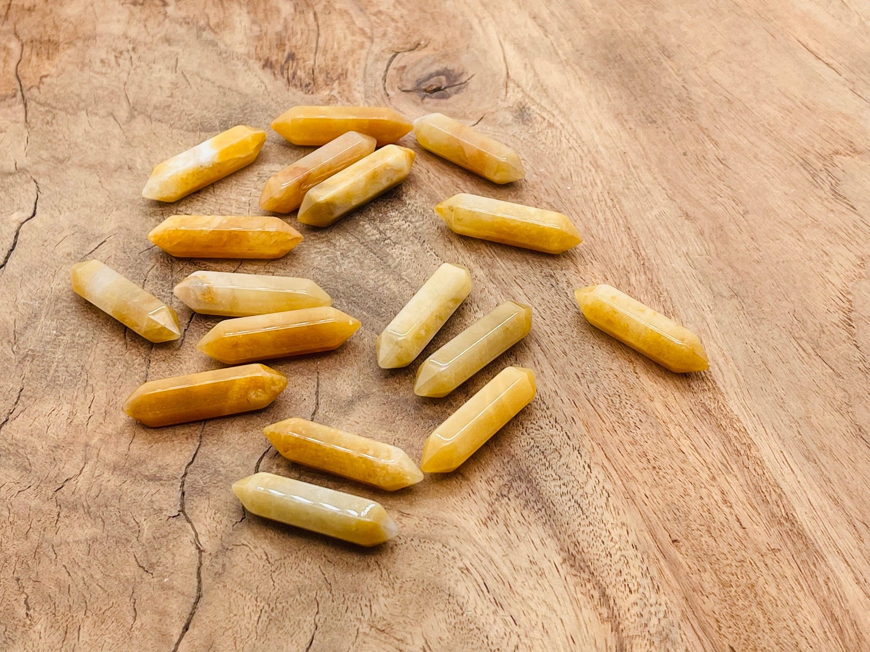 Yellow aventurine terminated carved crystal point, 33mm gemstone from GemstoneGO, showing detailed natural stone textures and vibrant color.