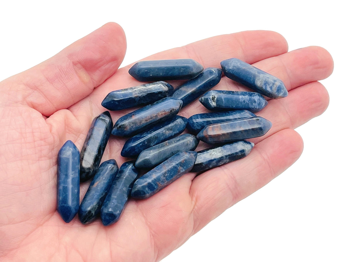 Sodalite terminated carved point gemstone from GemstoneGO, 33mm, showcasing rich blue and white natural mineral patterns.