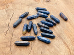 Sodalite terminated carved point gemstone from GemstoneGO, 33mm, showing deep blue and white veined patterns.