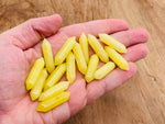 Lemon Jade Terminated Carved Point gemstone, 33mm, from GemstoneGO, showing smooth carved surface and natural yellow-green color.