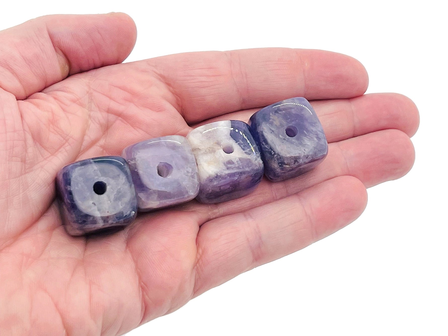Handmade amethyst crystal incense holder with carved design, featuring a stone base for incense sticks.