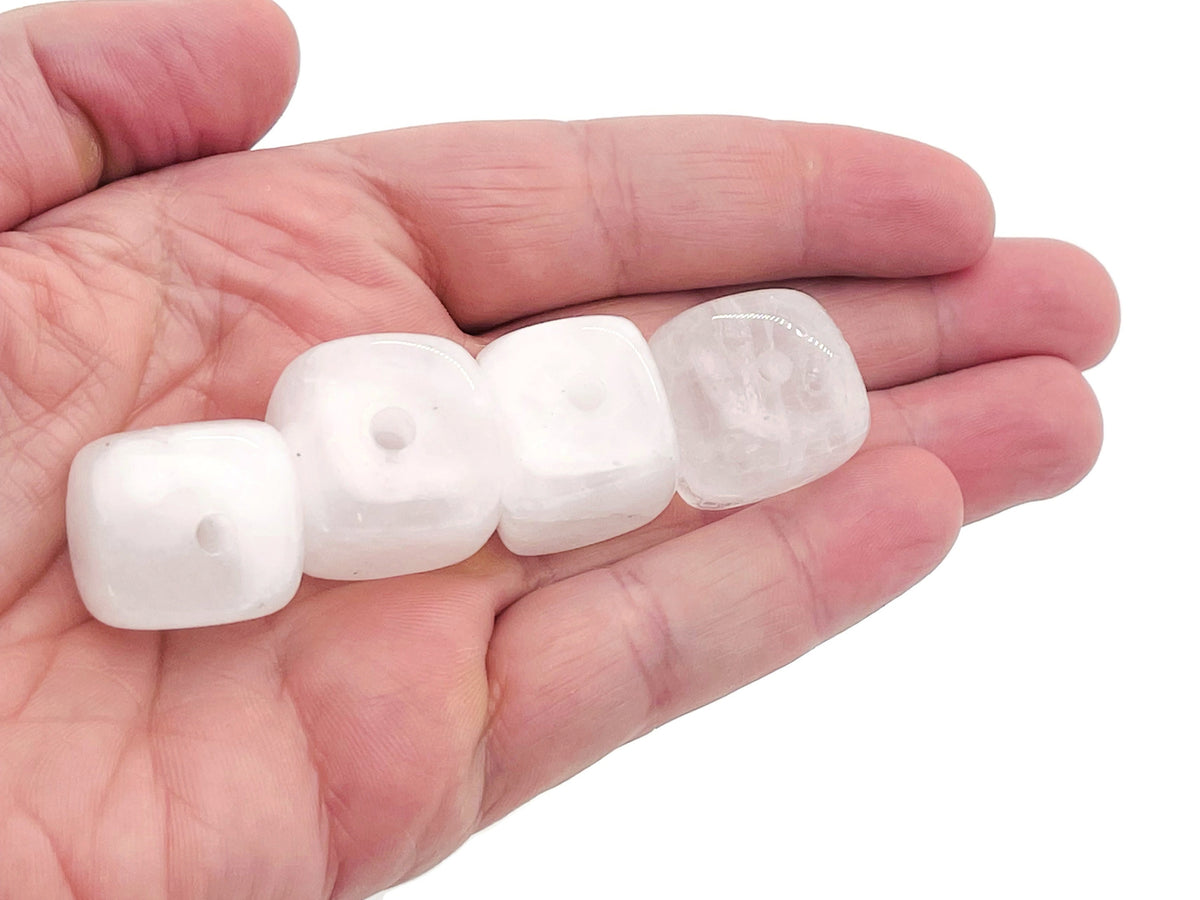 Handmade clear quartz crystal incense holder with carved details, designed to hold incense sticks securely.