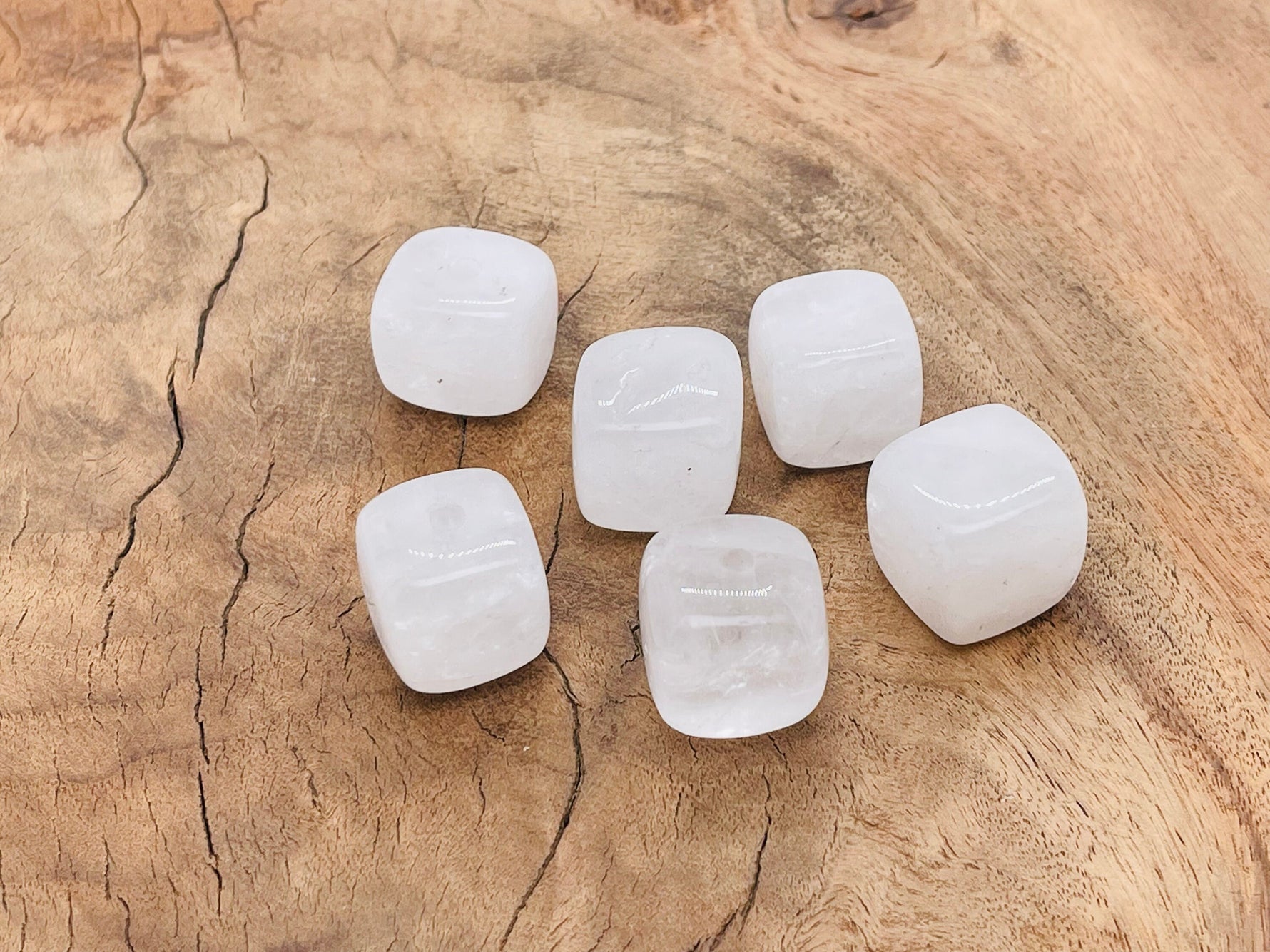 Handmade clear quartz crystal incense holder with carved design, perfect for holding incense sticks and showcasing natural gemstone beauty.