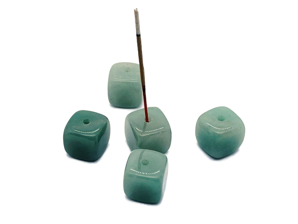 Handmade aventurine crystal incense holder with carved design, featuring a stone base and space for incense sticks.