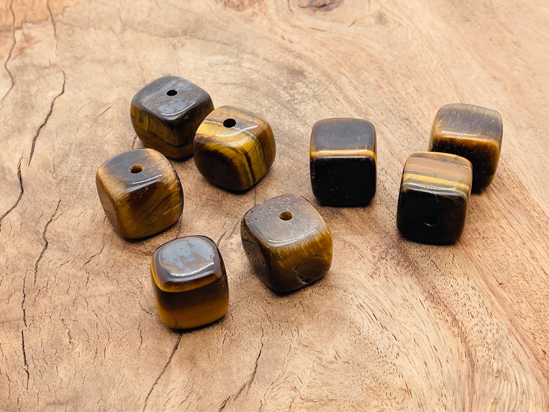 Handmade tiger eye crystal incense holder with carved design, featuring a stone surface and a slot for incense sticks.