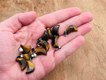Tiger Eye moon crystal pendant by GemstoneGO, featuring a polished gemstone with a moon shape, ideal for jewelry making.
