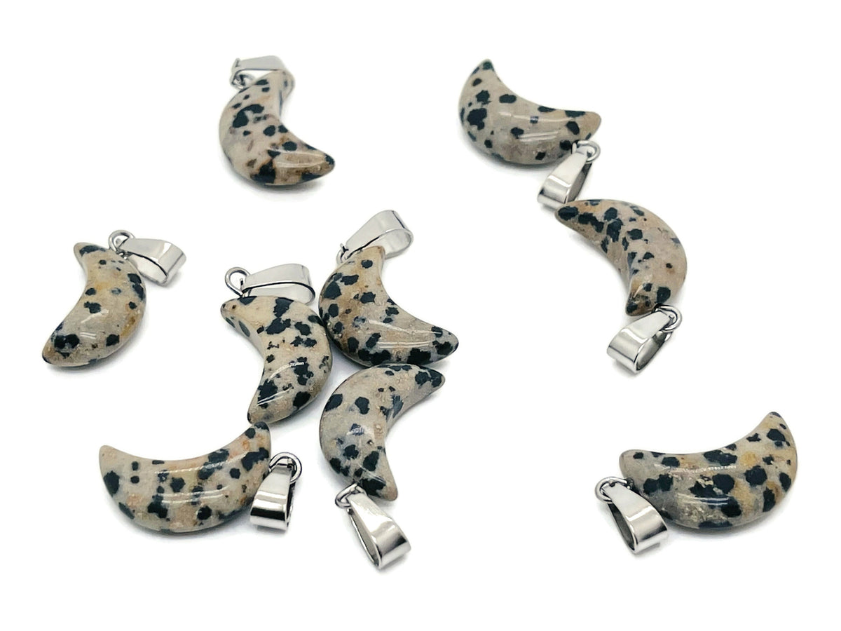 Dalmatian Jasper moon-shaped crystal pendant from GemstoneGO, ideal for jewelry making, featuring distinctive black spots on a cream background.